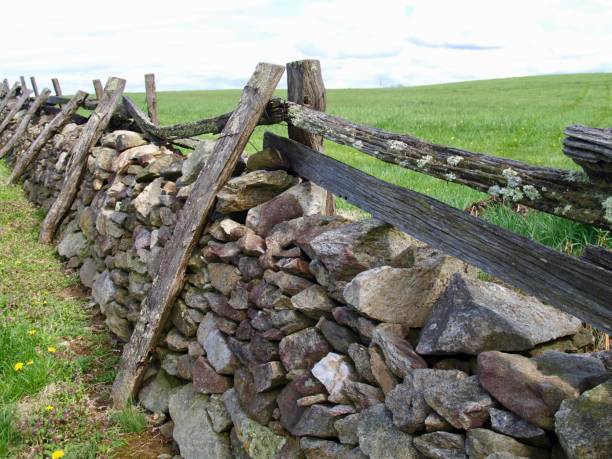 Stacked stone and wood fence