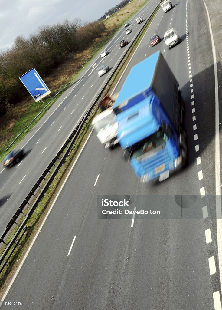 Big Blue Truck A big blue truck speeds south on a UK motorway. Light Goods Vehicle Stock Photo