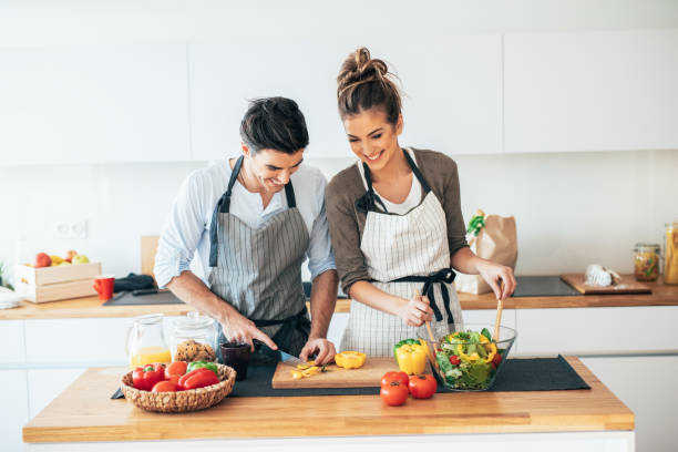 istock Young couple cooking healthy 1159427260