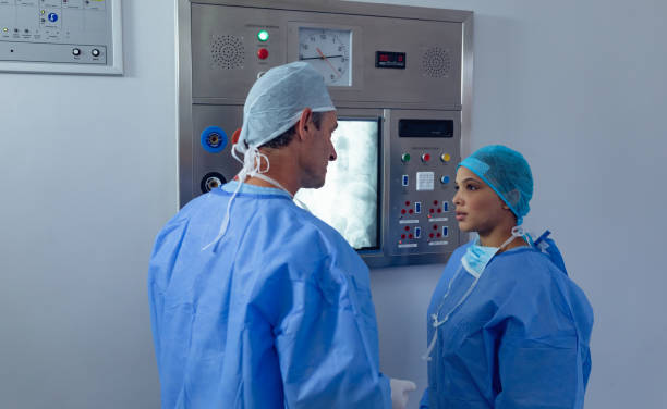 istock Surgeons interacting with each other at hospital 1159427457