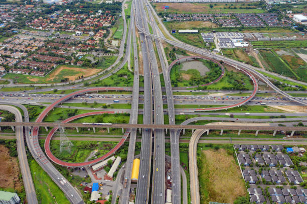 istock Aerial view of highway junctions. Bridge roads shape number 8 or infinity sign in structure of architecture concept. Top view. Urban city, Bangkok, Thailand. 1159428399