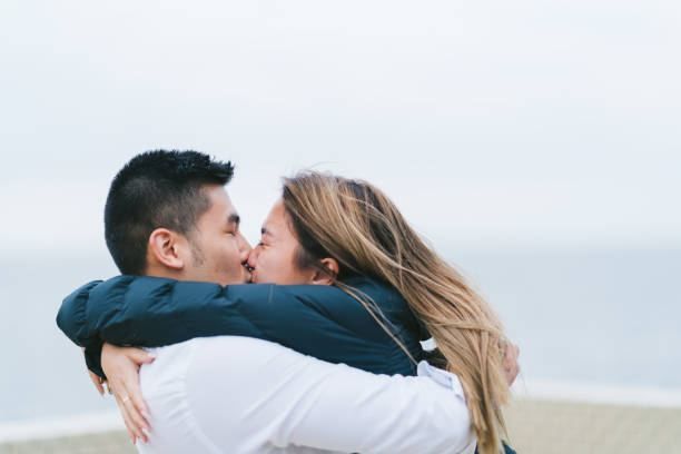 istock Young couple kissing each other 1159428860