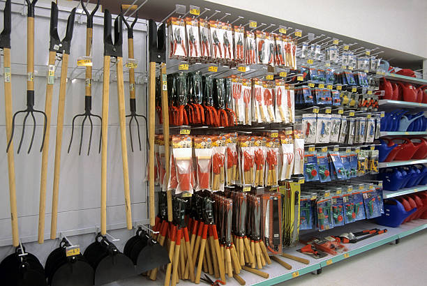 gardening section in a supermarket - tuin gereedschap stockfoto's en -beelden