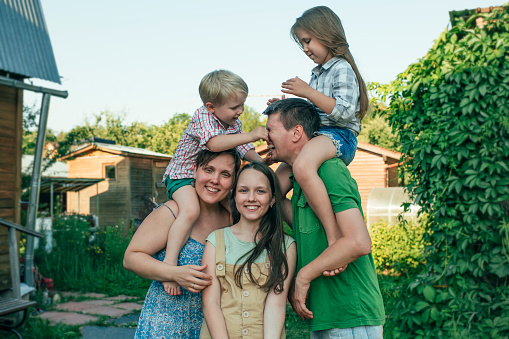 Young family of five in summer