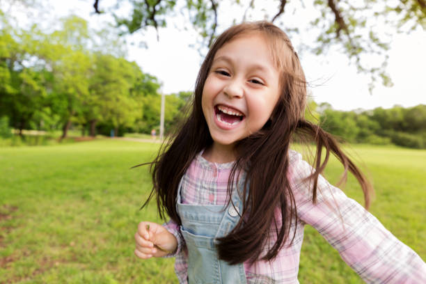 istock Little girl playing outside 1159431914