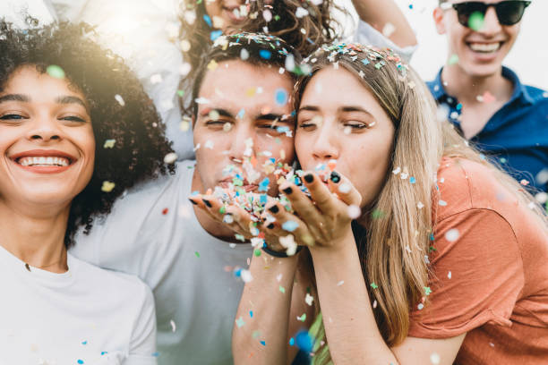 istock Group of friends having fun together with confetti 1159432164