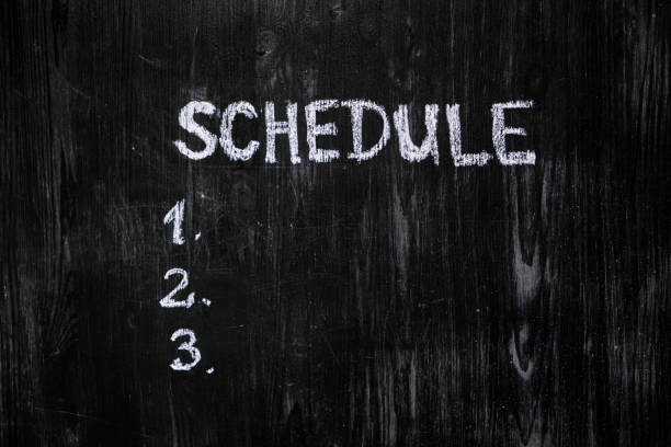 istock Schedule list handwritten with chalk on blackboard. 1159432279