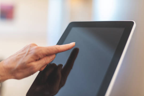 istock Corporate People Using Digital Tablet Technology Mature Adult in Corporate Office Space in Western Colorado 1159434414