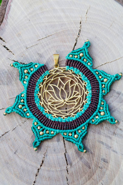 istock Brass metal pendant with macrame technique jewelry pendant 1159434533