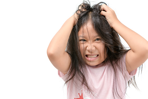 Girl itchy his hair or frustrated and angry kid isolated white background, problem Health concept