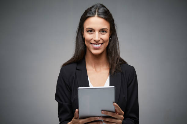 istock Business woman holding a digital tablet. 1159438162