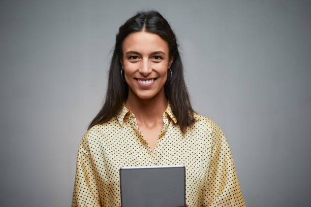 istock Business woman holding a digital tablet. 1159438172
