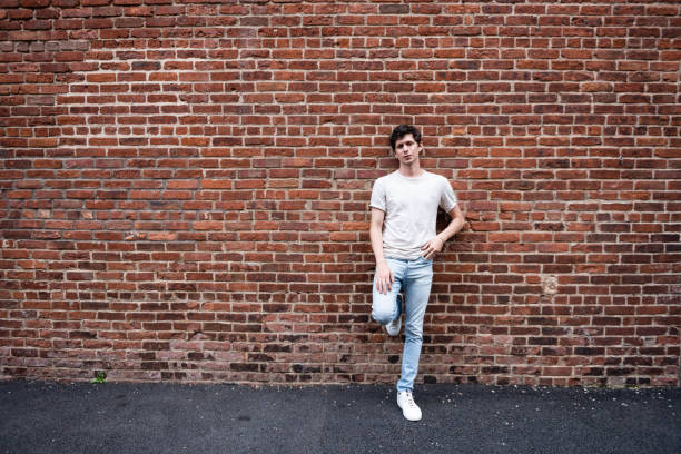 Free Stock Photo of Man Standing in Front of White Brick Wall ...