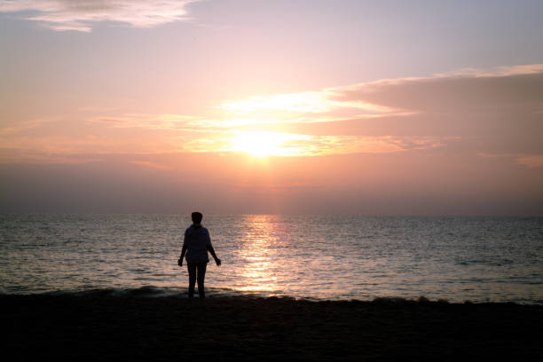 istock Person opening to the sun 1159438563