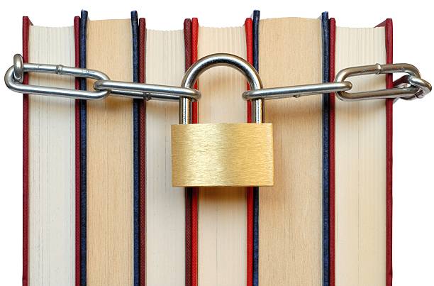 Books and Chain Isolated books and chain with padlock denial stock pictures, royalty-free photos & images