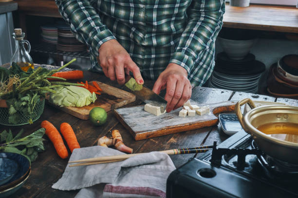 istock Cutting Tofu on Wooden Cutting Board 1159443622