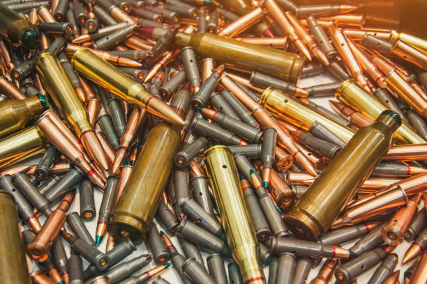 istock Ammo bullets, military war background. Army supplies texture. 1159444659