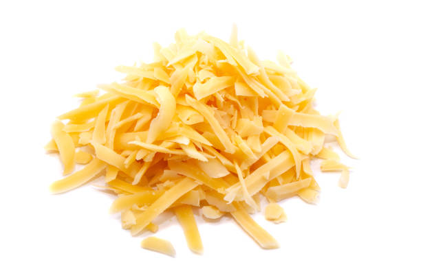 istock Delicious grated cheese on white background 1159446474
