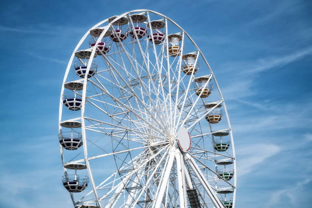 istock Ferris Mill, big  wheel on a background of blue sky. 1159448025