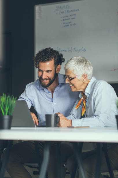 istock Colleagues meeting in office and discussing over a report 1159448986