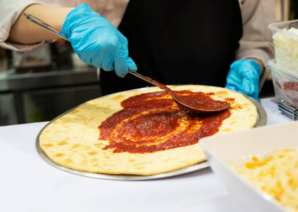 istock Chef preparing pizza, Chef process of making pizza in pizza restaurant 1159449209