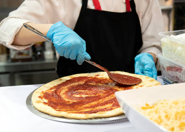 istock Chef preparing pizza, Chef process of making pizza in pizza restaurant 1159449211