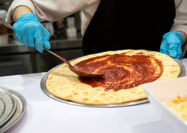 istock Chef preparing pizza, Chef process of making pizza in pizza restaurant 1159449215
