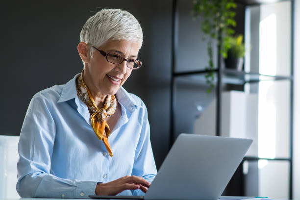 istock Senior businesswoman working at office 1159449476