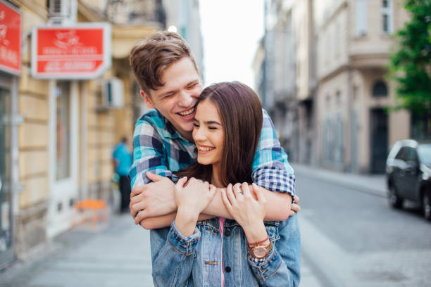 istock Couple hugging and smiling 1159449568