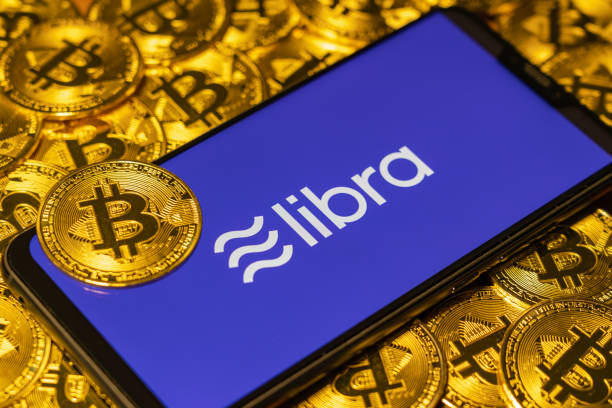 Bitcoin with the Libra text Gold Bitcoin Coins pile with the Facebook's Libra Crypto Coin logo on smartphone screen libra photos stock pictures, royalty-free photos & images