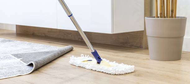 istock Wooden floor with white mop, cleaning service concept 1159452420
