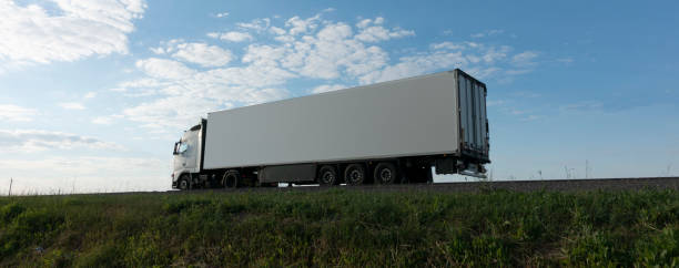 Truck driving on the asphalt road rural landscape. Truck driving on the asphalt road rural landscape. car carrier semi stock pictures, royalty-free photos & images