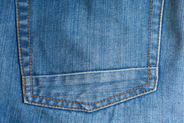 istock Elements of denim trousers. Blue cotton fabric. Creative vintage background. 1159453968