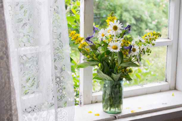 istock Bouquet on windowsill in countryside 1159454054