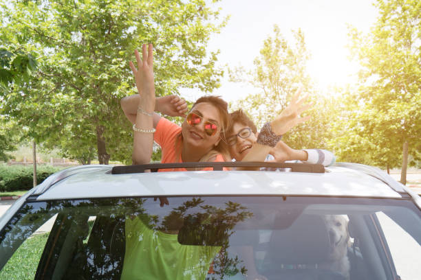 istock People on summer vacation leaning out sunroof 1159455111