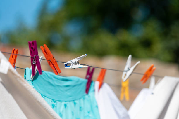 istock Clean laundry dried hang over on the wire, clips and laundry close up 1159455242