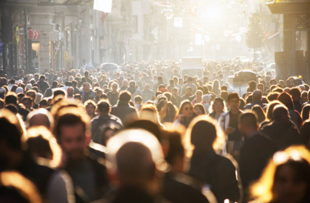 istock Blurred crowd of unrecognizable at the street 1159457357