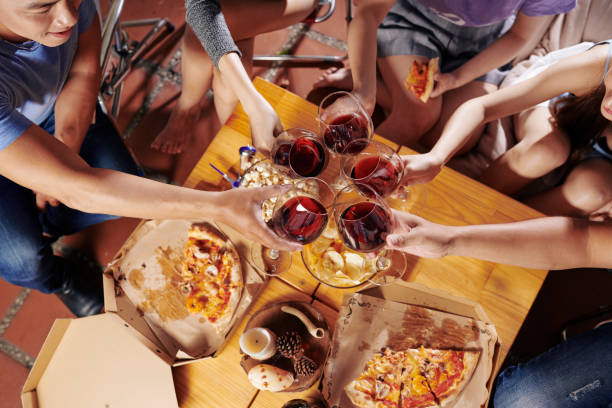istock Toasting friends at party 1159457504