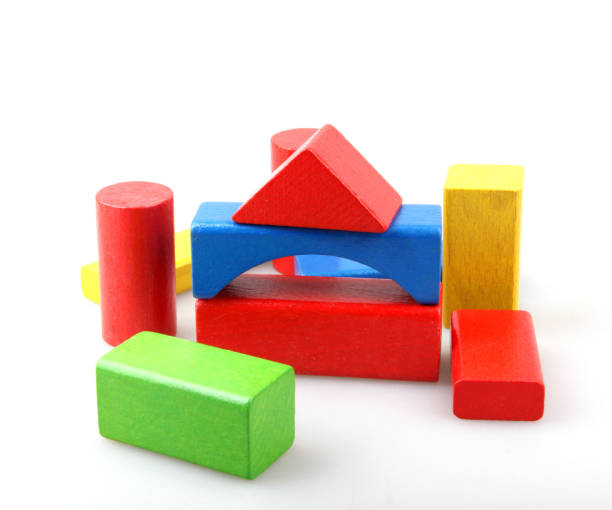 istock Wooden building blocks isolated on white 1159458044