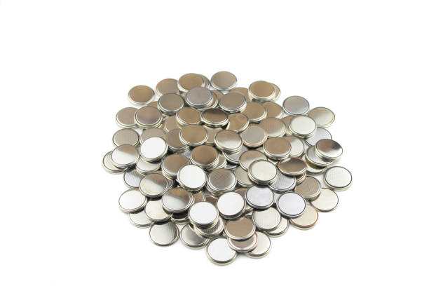 istock Heap of lithium button cell batteries. Isolated on white background. Closeup. 1159460149