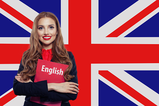 Happy woman against the UK flag background. Learn english language concept