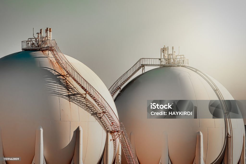 Sphere gas tanks in refiney plant Natural Gas Stock Photo