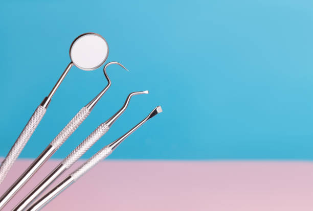 istock dental tools on pink background top view 1159463081