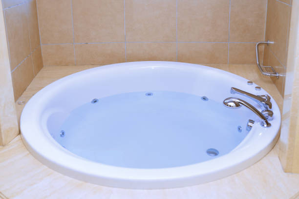 istock Modern bathtub full of water 1159465111