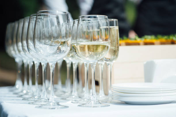 istock Many glasses on the bar. Drinks in glasses. Glass goblets 1159465916