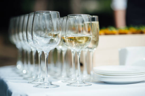 istock Many glasses on the bar. Drinks in glasses. Glass goblets 1159465933