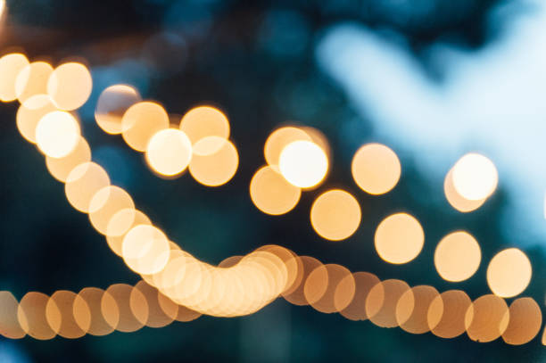istock Light bulb decor in outdoor party. blurred photo 1159466360