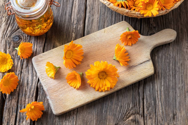 istock Preparation of herbal tincture from blooming calendula 1159467384