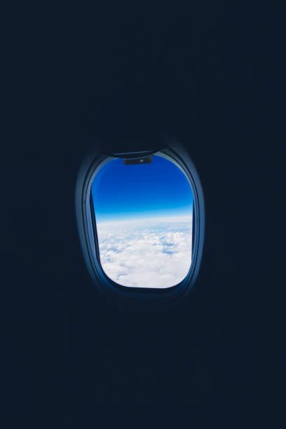 istock View from the plane window to the clouds and sky during the flight 1159469198