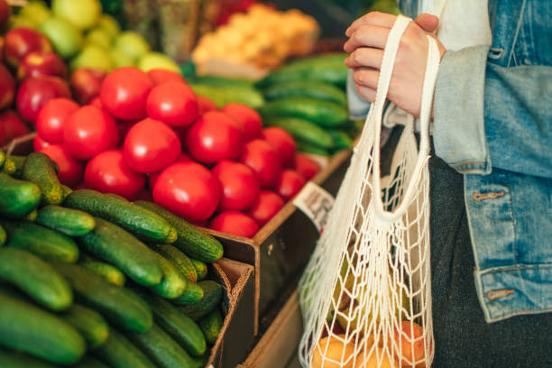 istock Vegetables and fruit in reusable bag on a farmers market, zero waste concept 1159469207